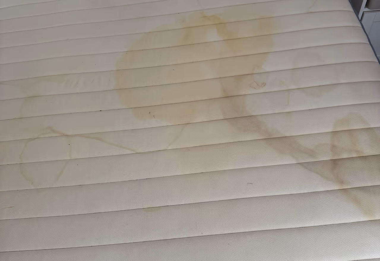 Stained mattress before cleaning